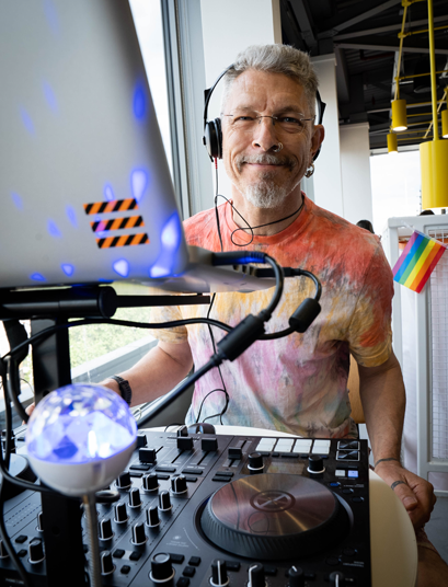 Simon DJing for pride event at the Just Eat offices